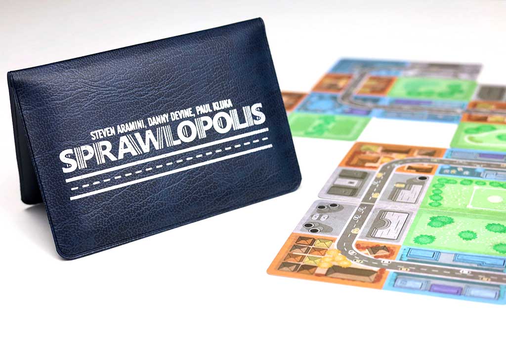 photo of sprawlopolis game cards and wallet